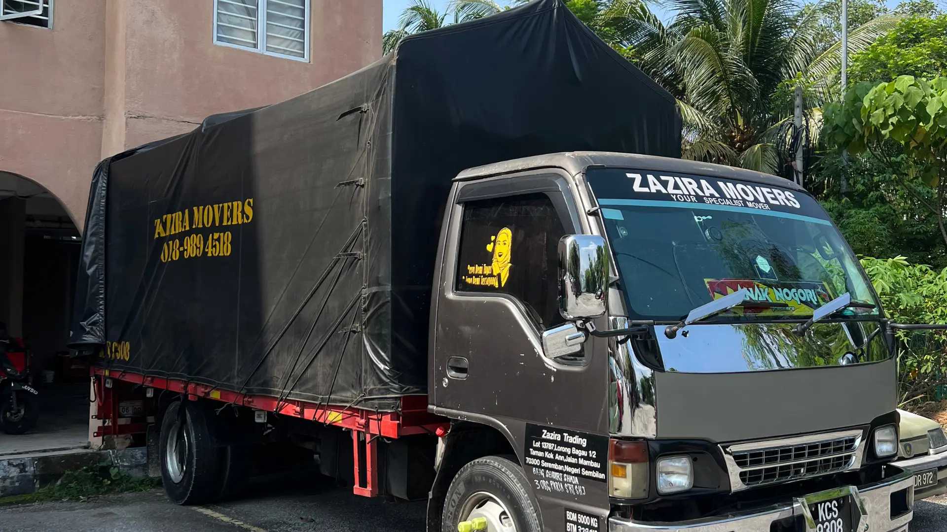 Moving crew handling furniture for a condominium or apartment move in Malaysia