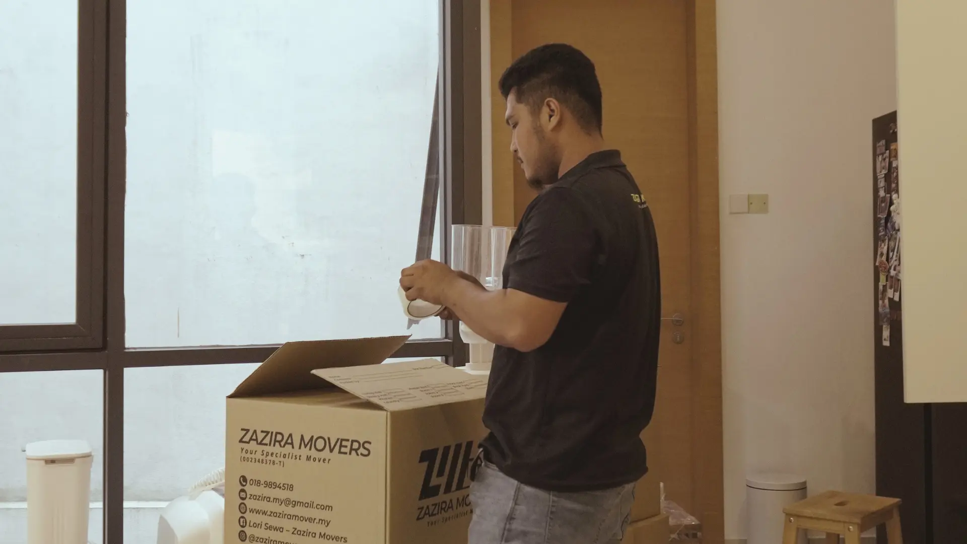 Movers in Seremban 2 Moving crew loading wrapped household items at a Seremban home