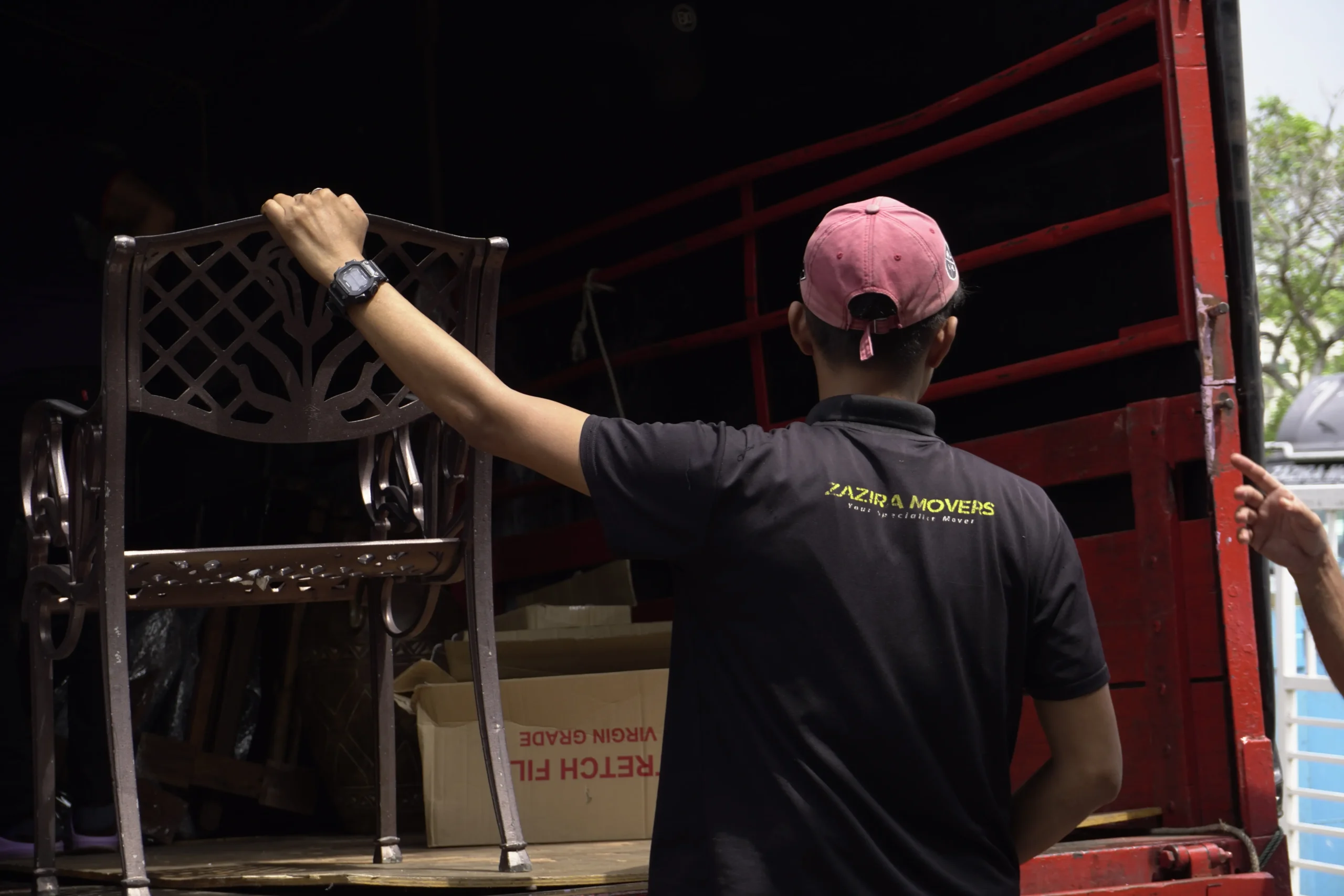 Zazira Movers team loading securely wrapped furniture for transport scaled